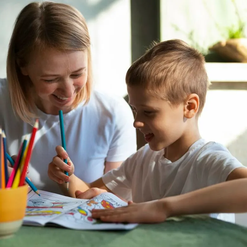 Mother educating her autistic son at home
