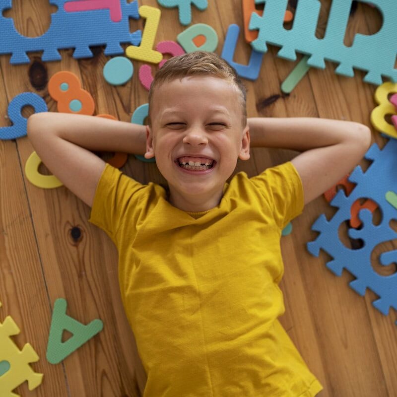 boy playing with brain teaser toys